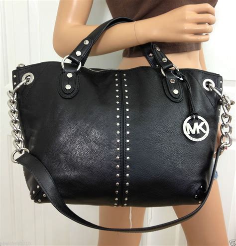 black michael kors with silver lock|black leather handbags Michael Kors.